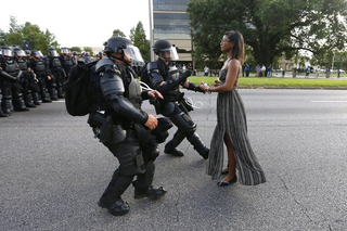 A woman’s peaceful act of resistance during a protest in Baton Rouge, La., became the symbol of a powerful moment in the Black Lives Matter movement. (Credit: Jonathan Bachman/Reuters)